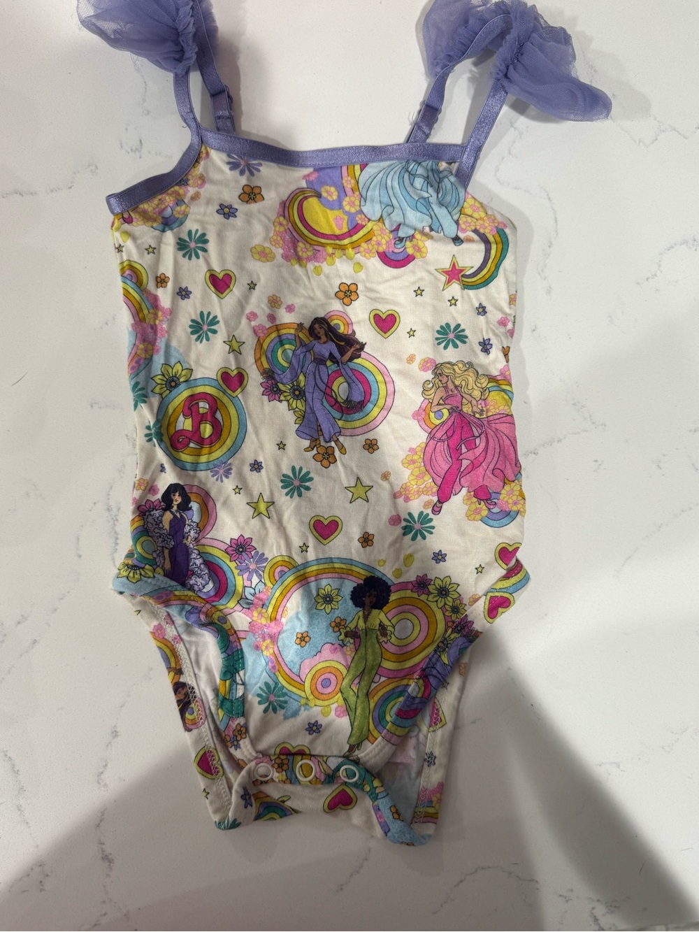 Posh Peanut White One-Piece Bodysuit with Purple Trim and Rainbow Print
